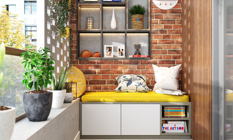 A cosy seating area with closed drawers and open shelves has been designed for a balcony.