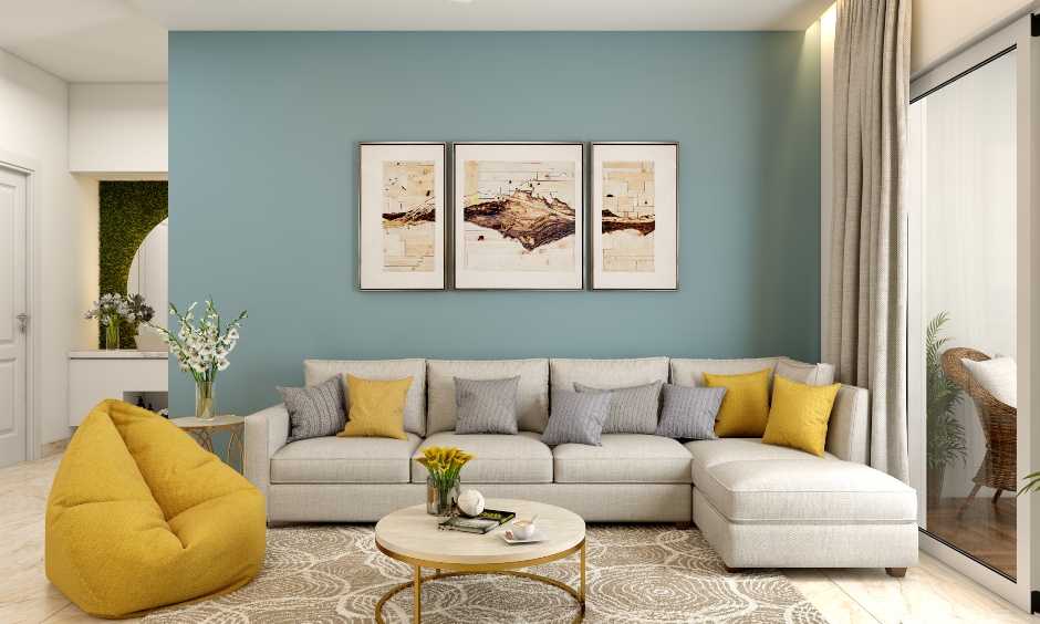 A sectional sofa is used in the living room of a 1BHK bedroom apartment.