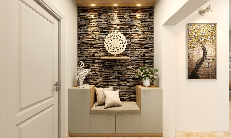 A stone-clad accent wall in the foyer of a one-bedroom apartment
