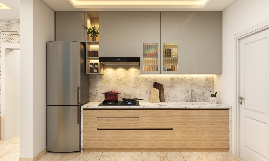 White countertops and backsplash adorn this compact 1BHK Apartment Modular kitchen.