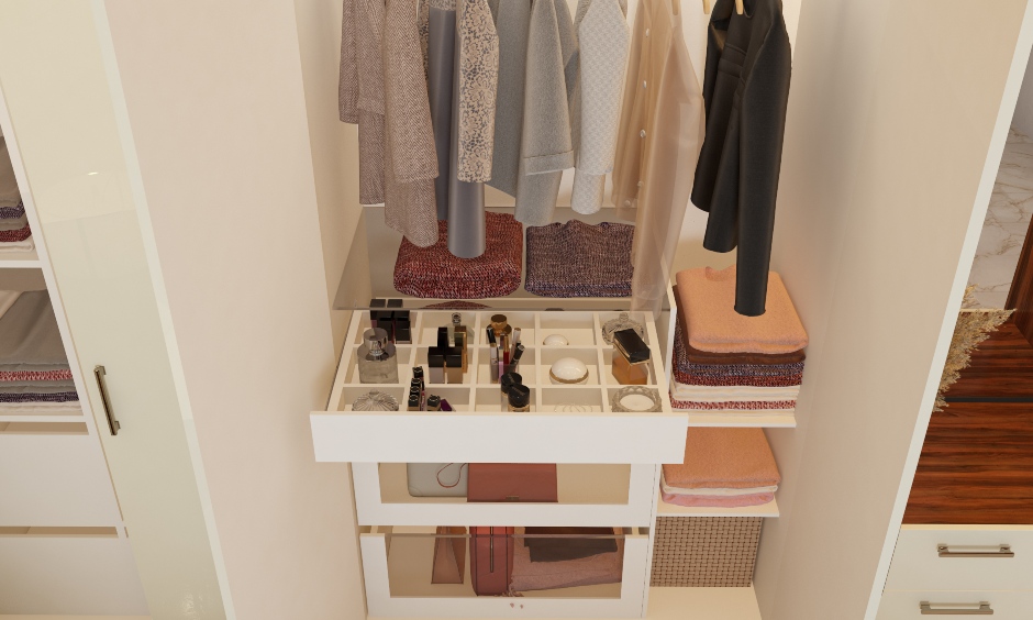 multiple drawers and shelves in a frosty white wardrobe