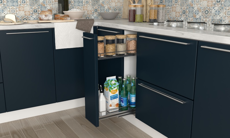 blue and white L Shape Modular kitchen design with a pull-out spice drawer