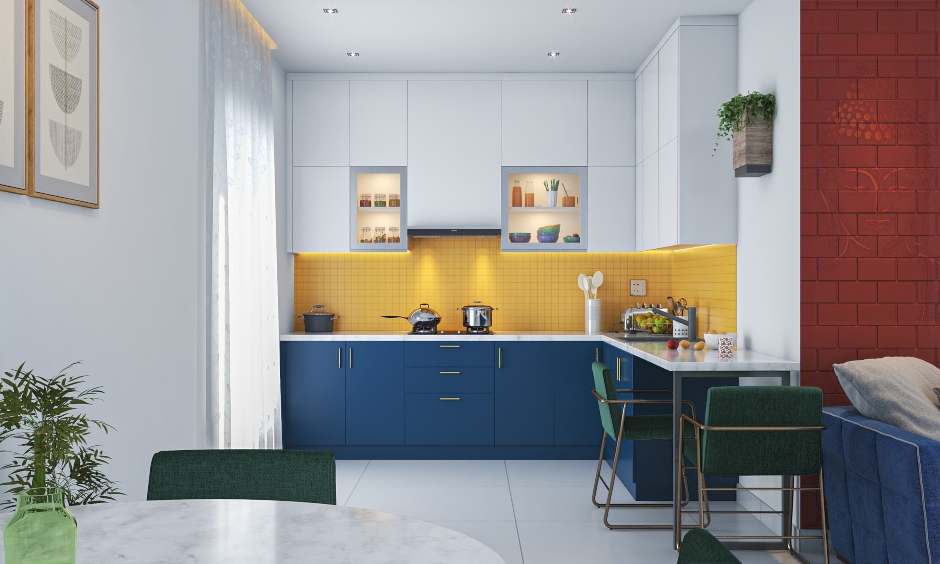 the contrast between the blue base cabinets and the white upper cabinets creates an eye-catching kitchen colour scheme