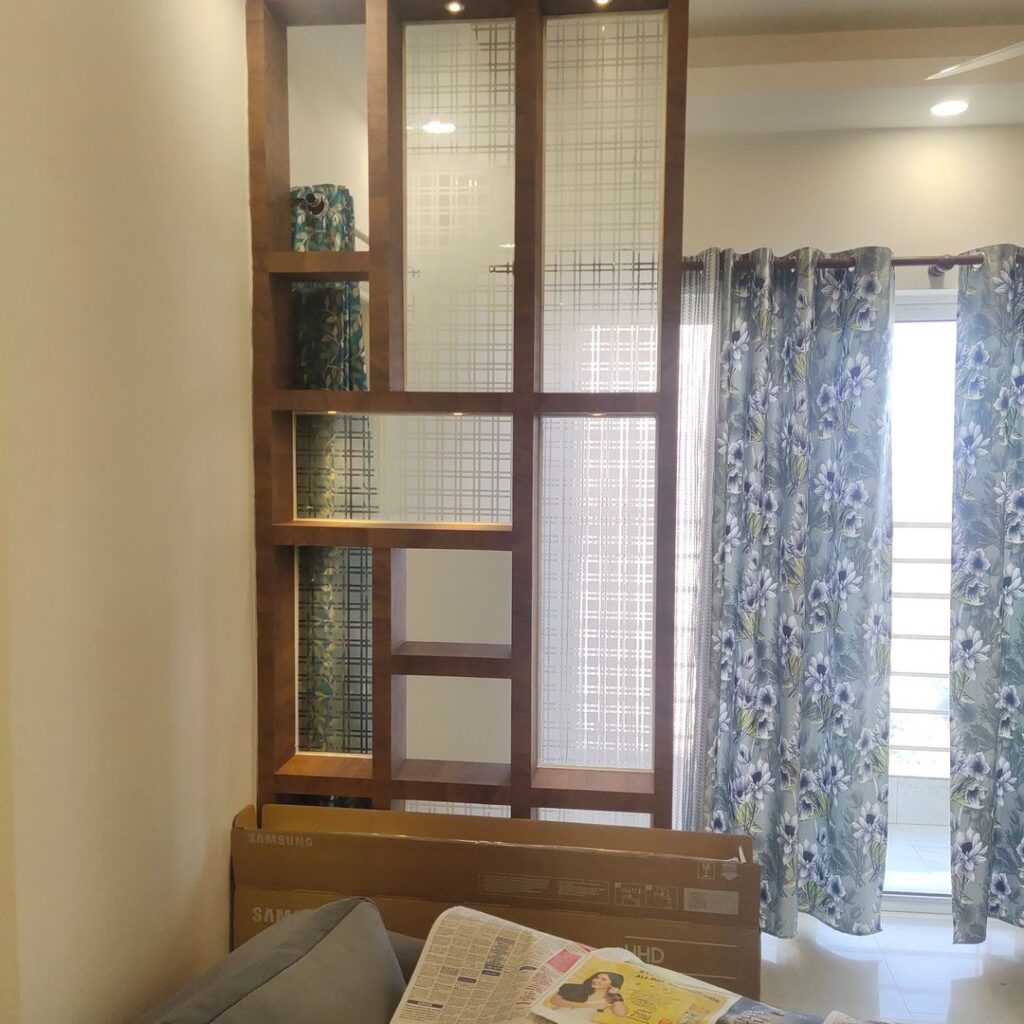 Wooden Partition with design glass in living room paras teria noida
