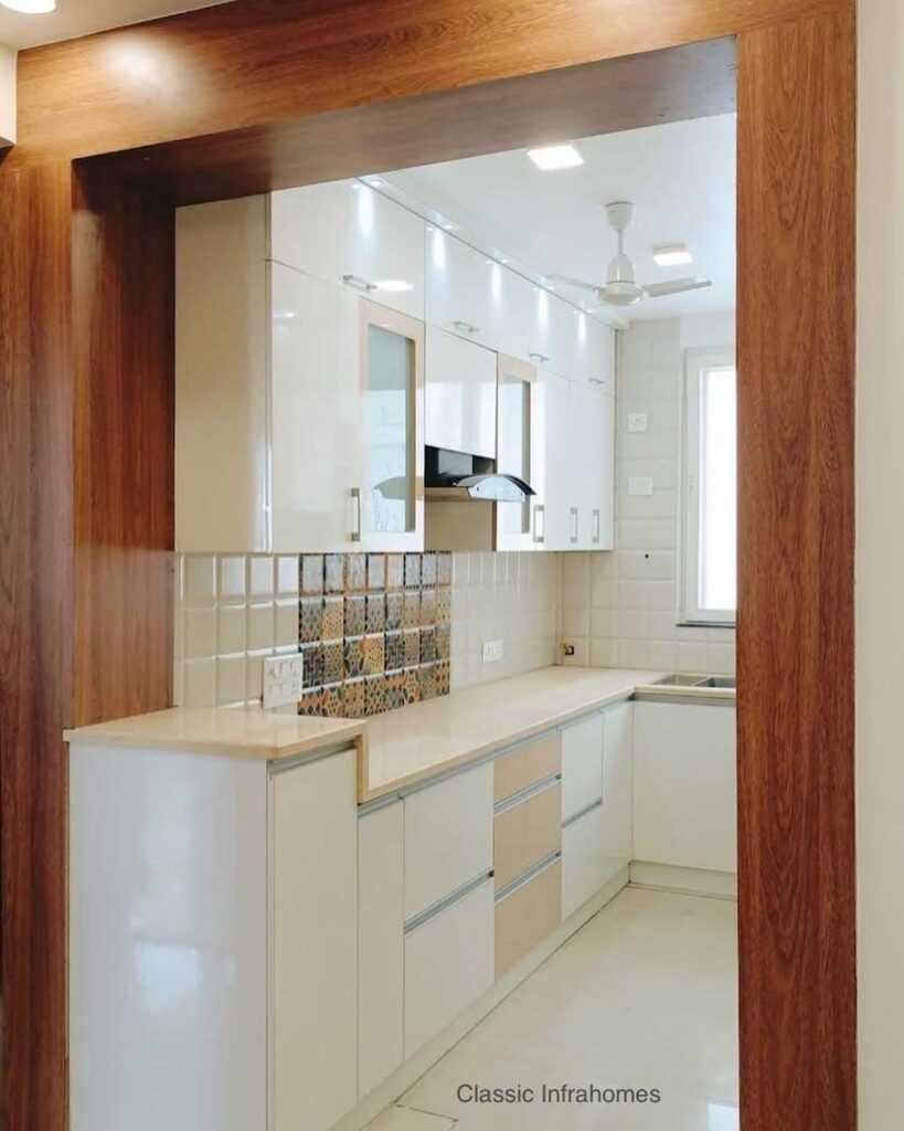 White and cream colour modular kitchen price in Noida.jpg