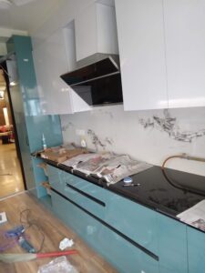 A Ocean Blue & White Coulor Wooden Modular Kitchen in Supertech Emerland Court Sector 93