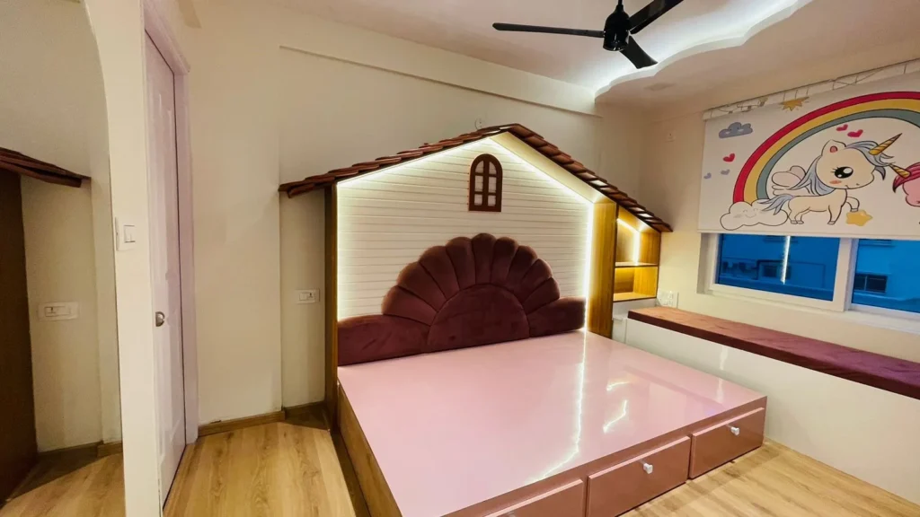 Children's room with fairy tale house-shaped headboard, scalloped velvet backrest, pink glossy bed platform and unicorn-themed decor