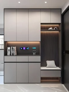Minimalist entryway storage unit with gray finish, LED lighting, and vertical fluted panels, featuring modern bench seating and smart technology controls