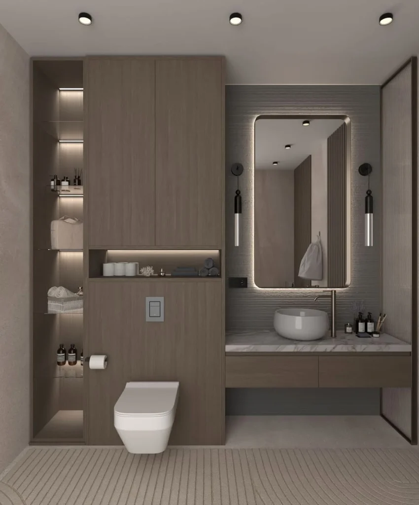 Modern wooden bathroom vanity with marble countertop, round sink, and LED lighting.