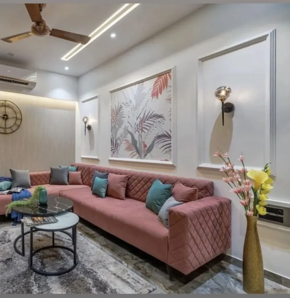 Rose Quilted Sofa Living Room with Tropical Wall Art  Noida Interiors by Classic Infrahomes
