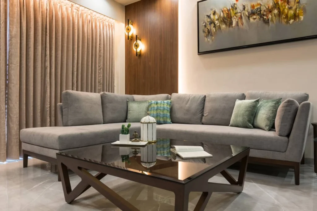 Taupe Sofa Living Room with Walnut Accent Wall  Noida Interiors by Classic Infrahomes