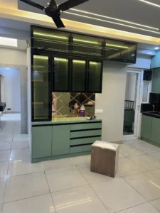 Modern Green and Black Crockery Unit with Glass Shelves and Ambient Lighting