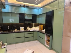 Modern Modular Kitchen with Aqua Green Finish and Black Marble Backsplash