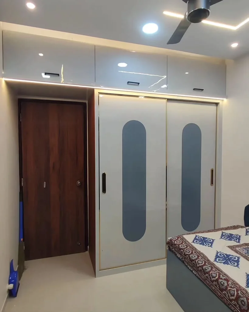 Discover our sleek and modern sliding wardrobe designs with matte finish and integrated LED lighting. Perfect for contemporary bedrooms, featuring practical sliding doors, gold accents, and stylish vertical handles.
