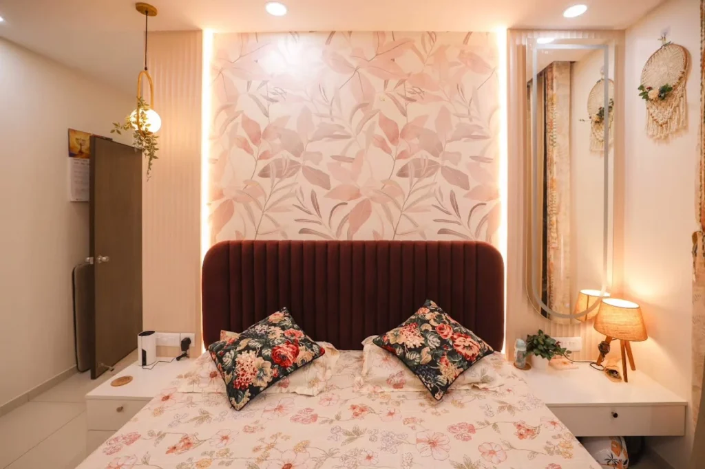 A Cozy Bedroom Design with Floral Back Panel and Upholstered Headboard