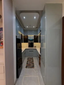 A Modern Parallel Kitchen Design with Glossy Finish and Smart Lighting
