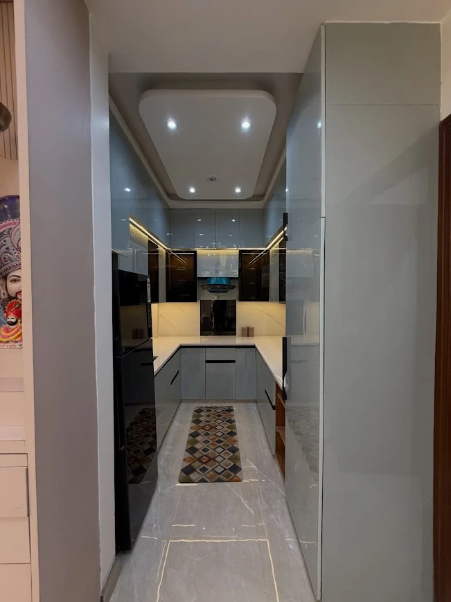A Modern Parallel Kitchen Design with Glossy Finish and Smart Lighting