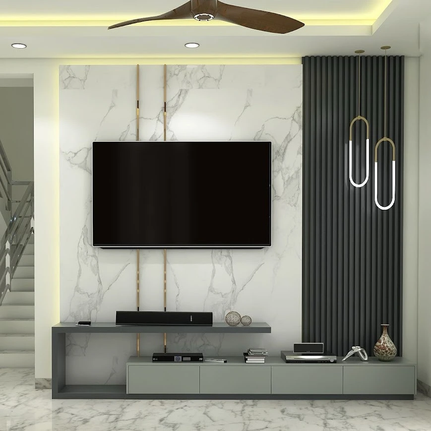 A Sleek TV Wall Design with Marble Finish and Statement Panel Lighting